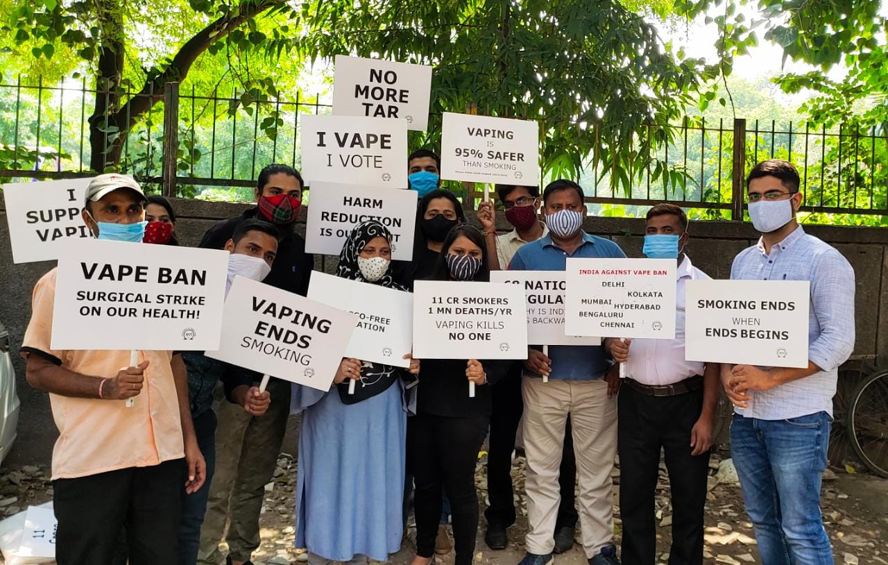 Vapers holding placards reading 'Vaping is 95% safer than smoking' and listing Delhi, Kolkata, Mumbai, Hyderabad, Bengaluru and Chennai, at a coordinated multi-city protest against the ENDS ban